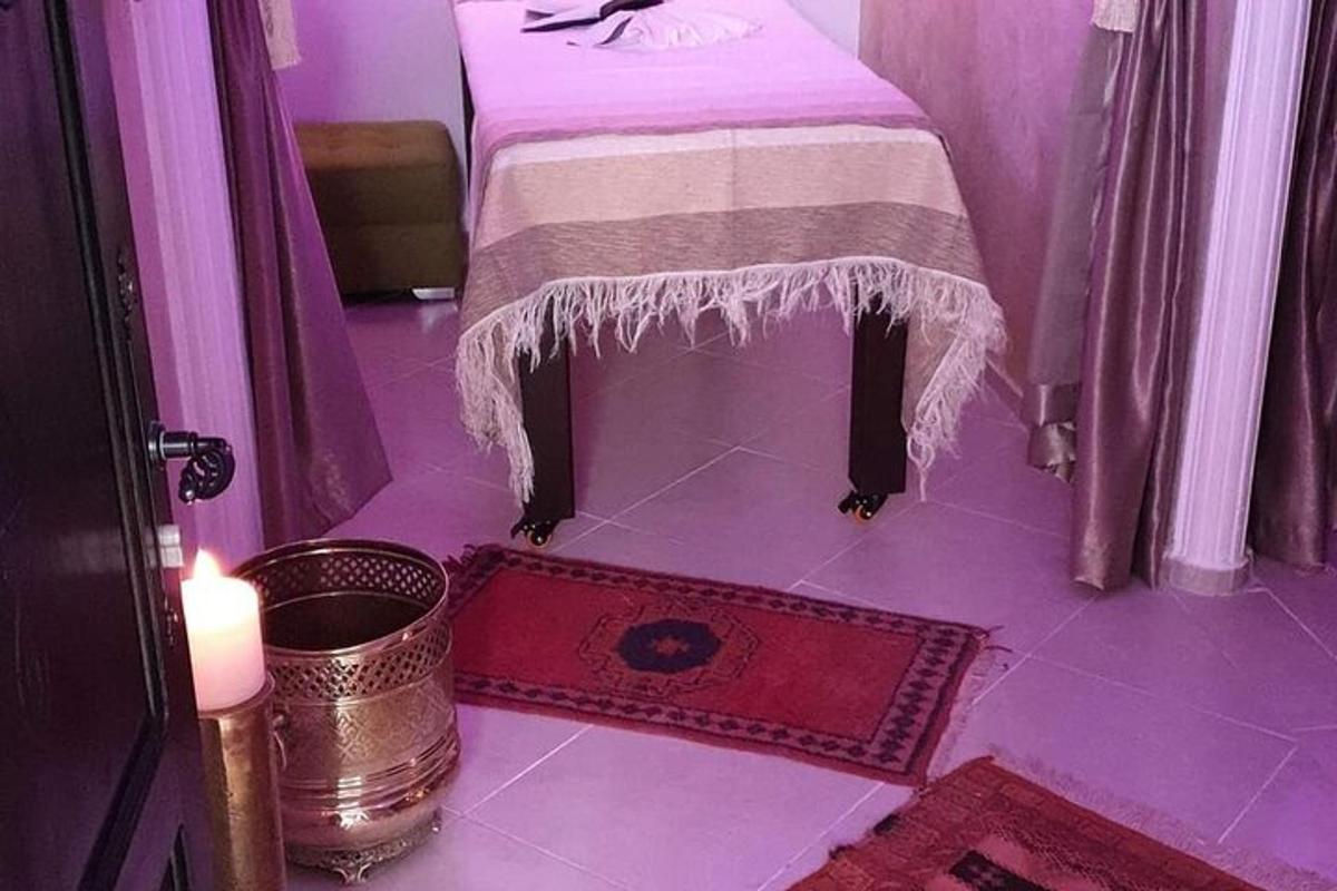 a purple room with a table with a blanket on it