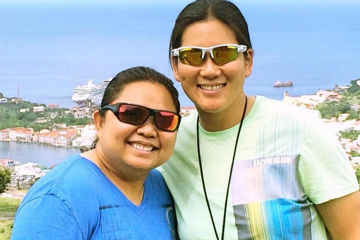 a man and a woman wearing sunglasses posing for a picture