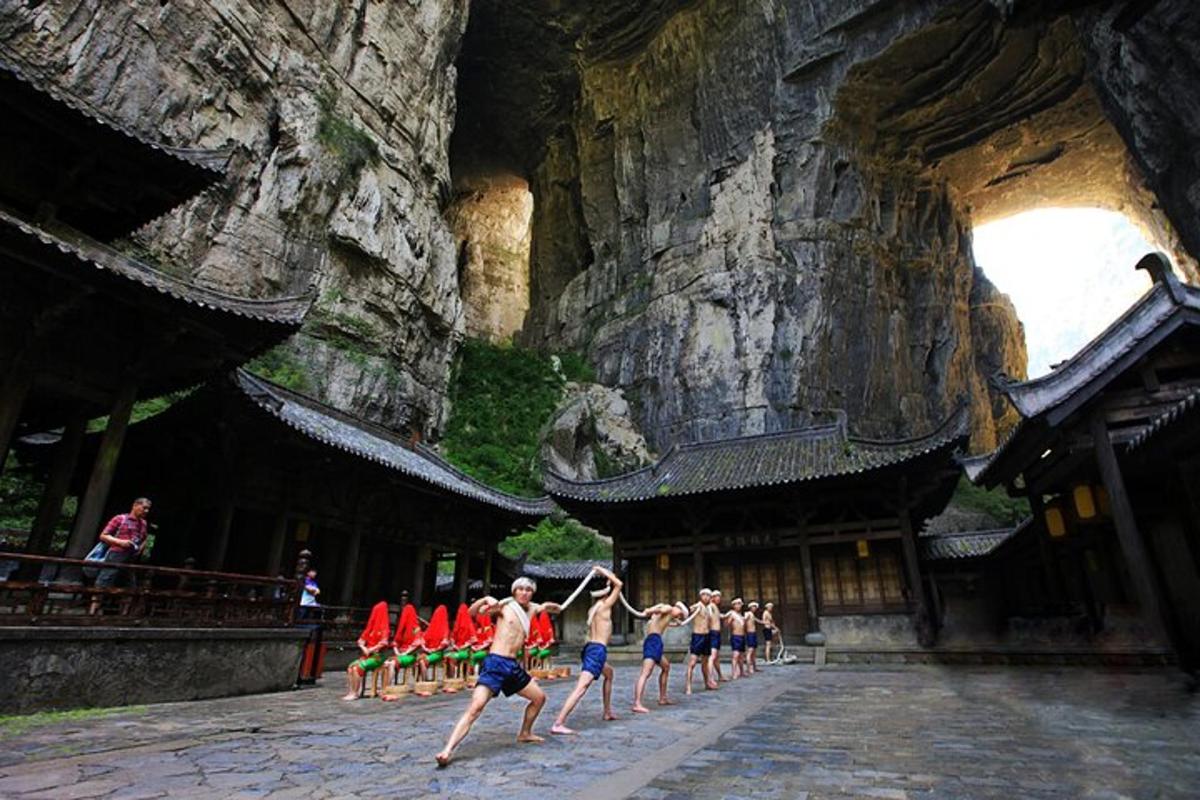 a group of people running in front of a building