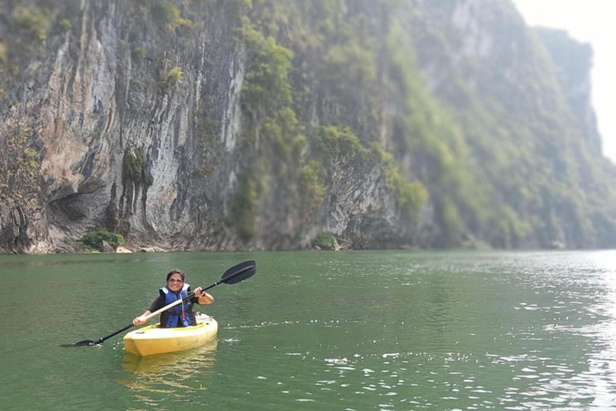 a woman is in a kayak in a river