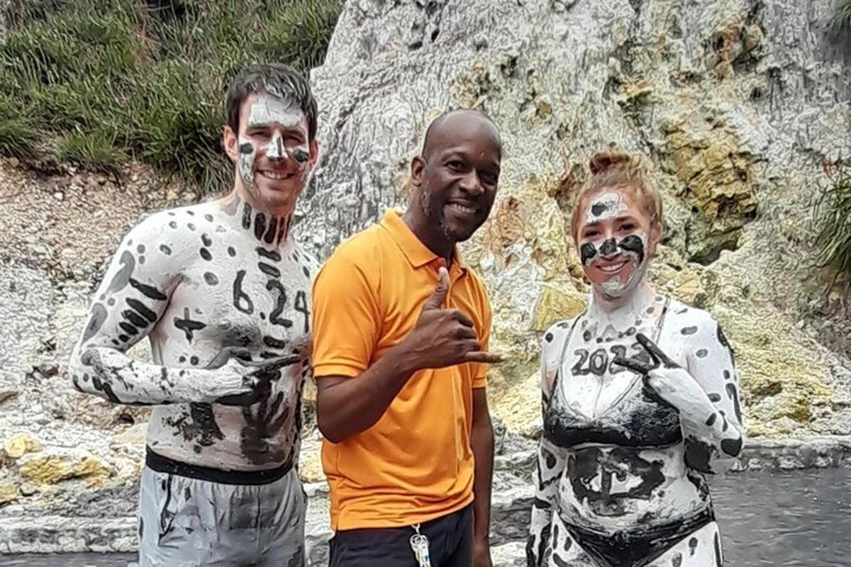 three men with paint on their faces posing for a picture