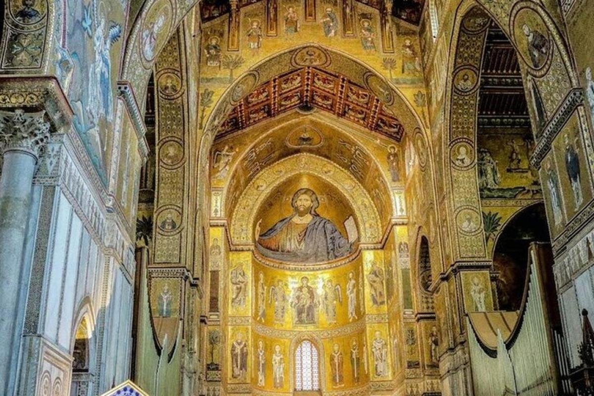 a church with a painting of a pope on the wall