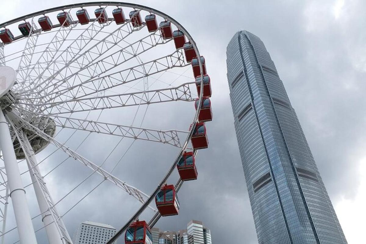a ferris wheel in front of a tall building