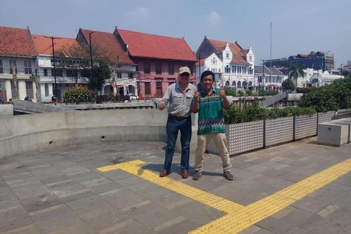 a couple of people standing on a roof