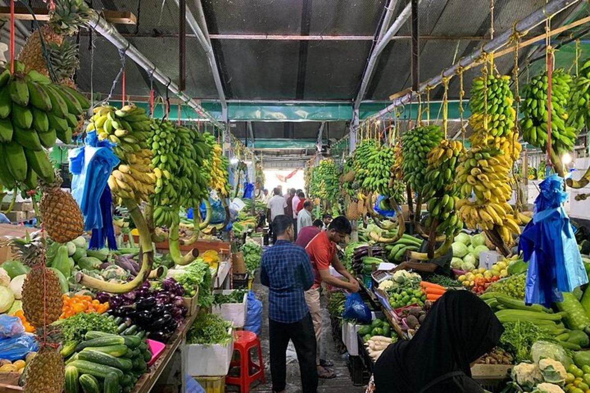 a market with bananas and other fruits and vegetables