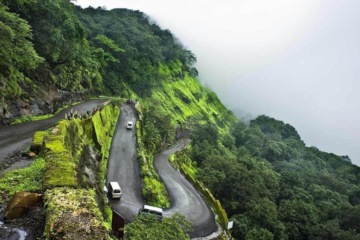 a winding road on the side of a mountain