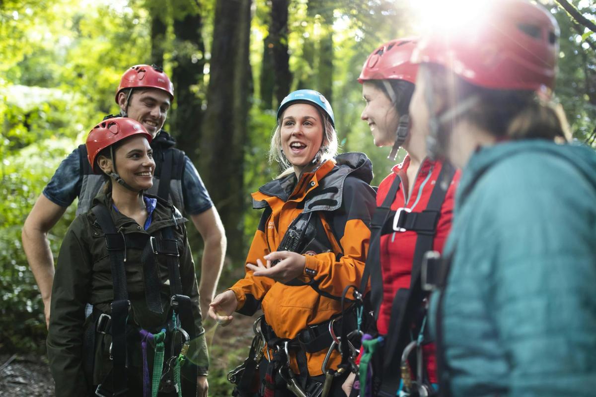 a group of people on a hike in the woods