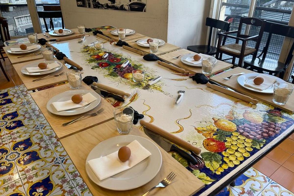a long table with plates and utensils on it