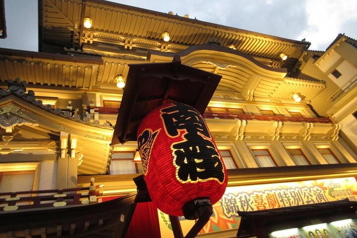 a red lantern with writing on it in front of a building