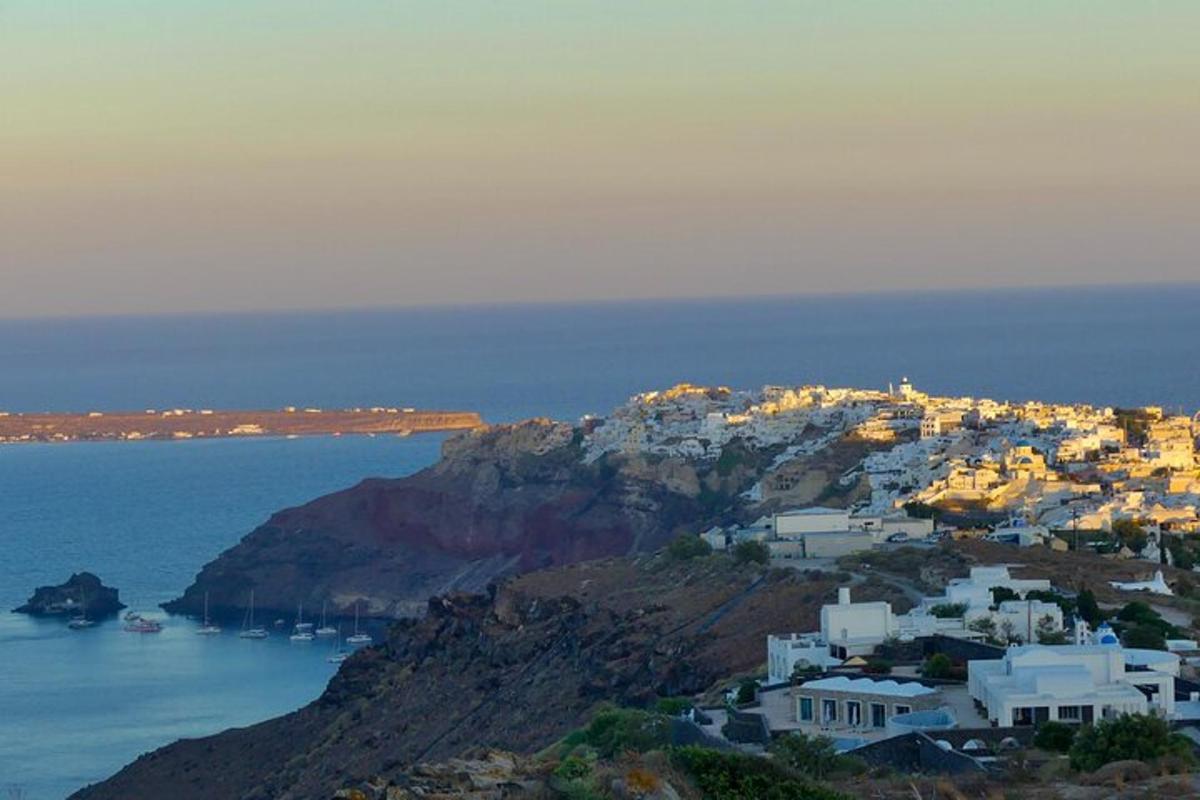 a small island with white houses on a mountain