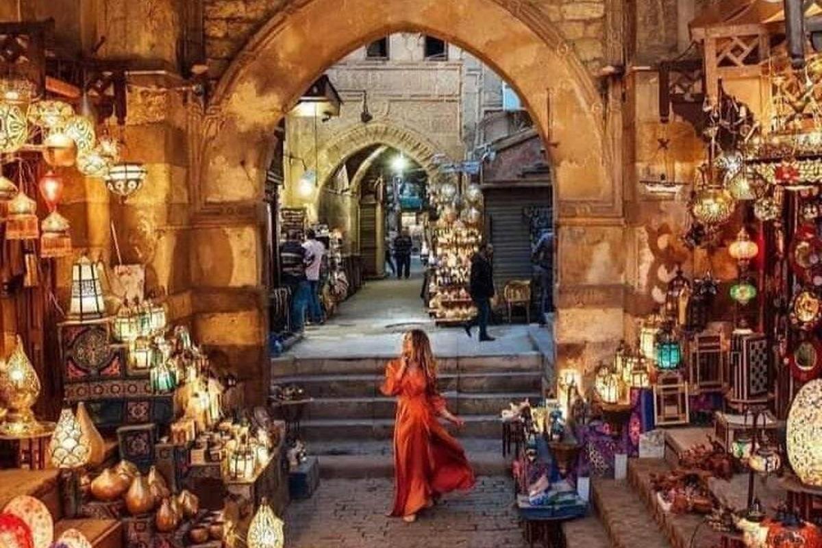 a woman walking through a market in aleppoppoppo city world cities