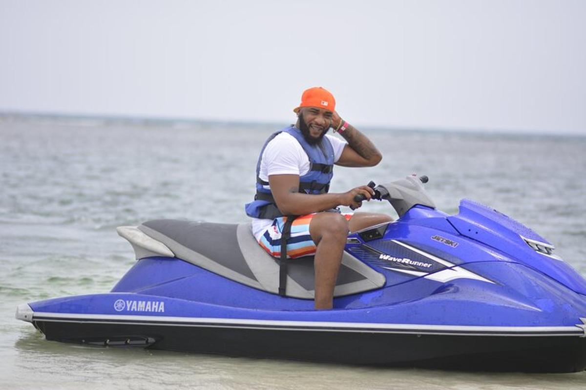 a man sitting on a jet ski in the water