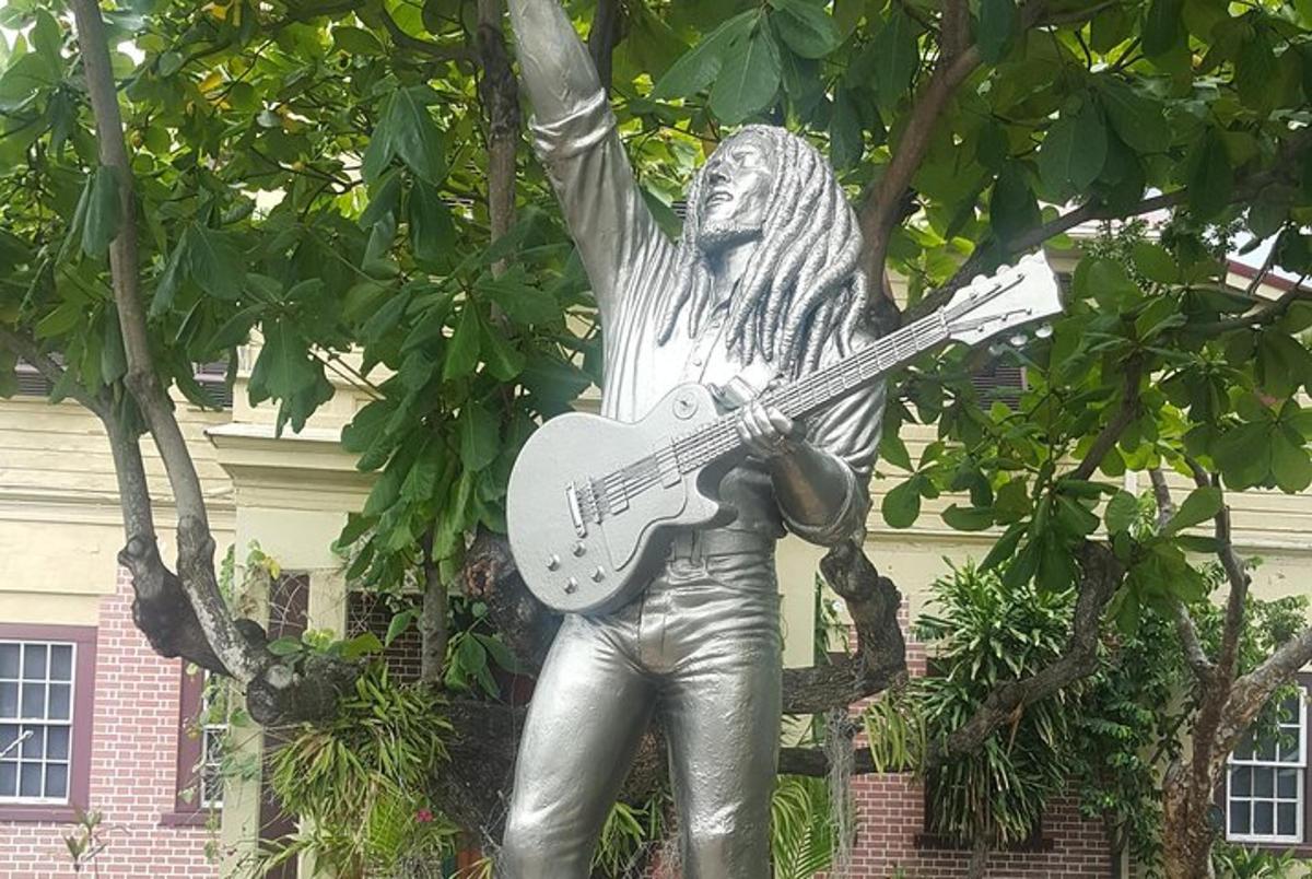 a statue of a man holding a guitar