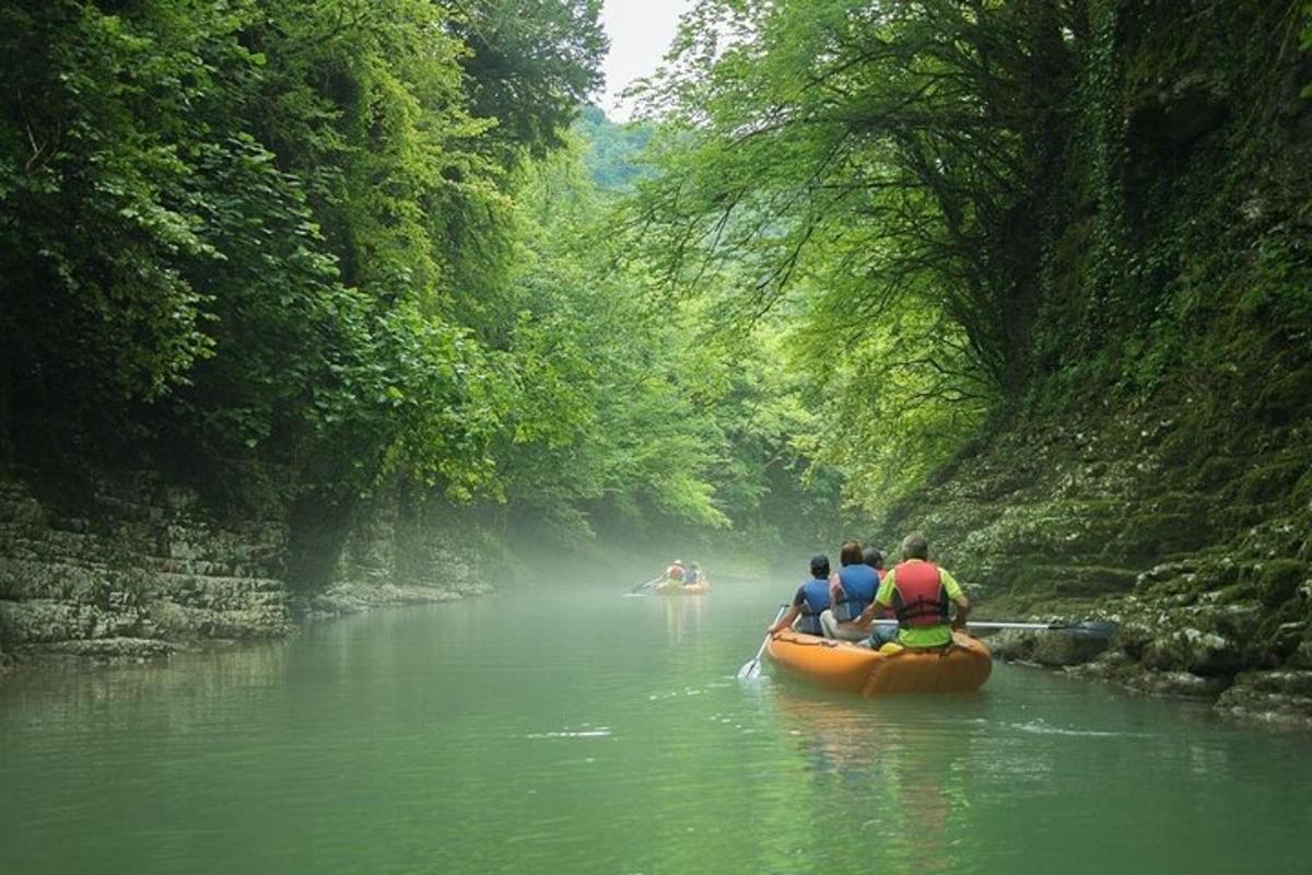 a group of people in a canoe on a river