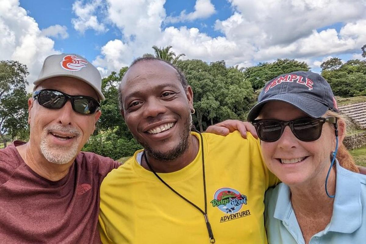 two men and a woman posing for a picture