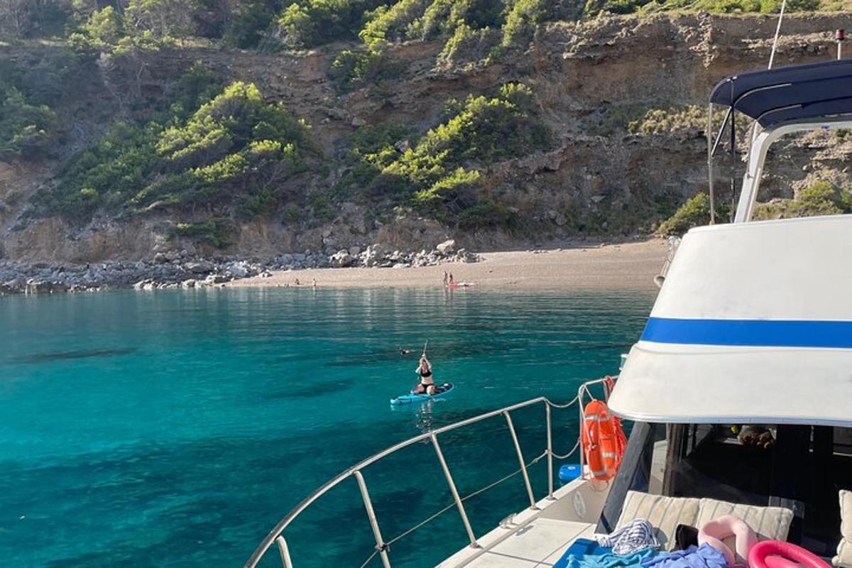 a person on a paddle board in the water on a boat