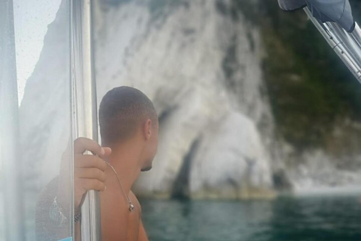 a man looking out the window of a boat