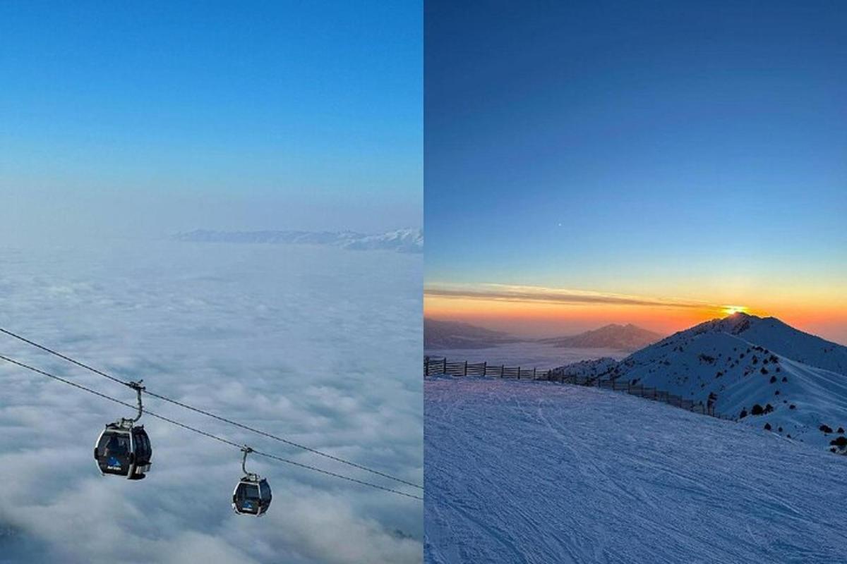 Lyžařský vlek nad zasněženou horou se západem slunce