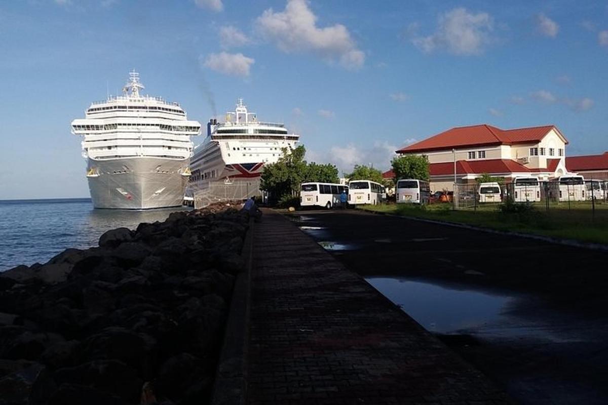 two cruise ships are docked in the water