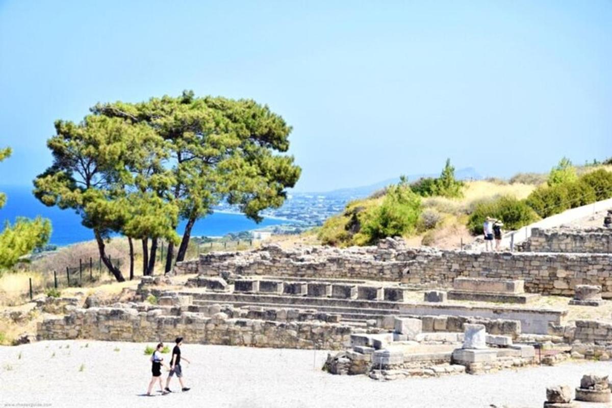 a group of people standing in front of a pyramid
