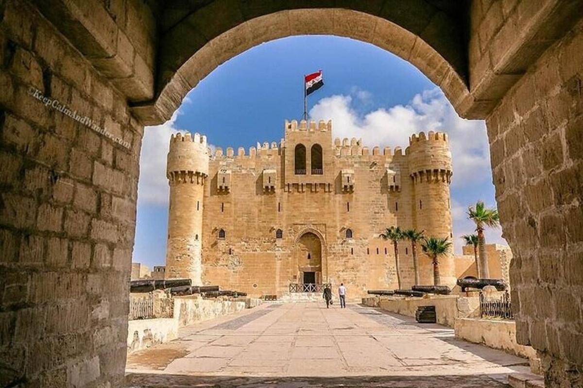 an entrance to a castle with a flag on top