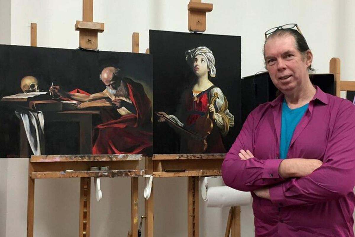 a man standing next to a painting of a woman