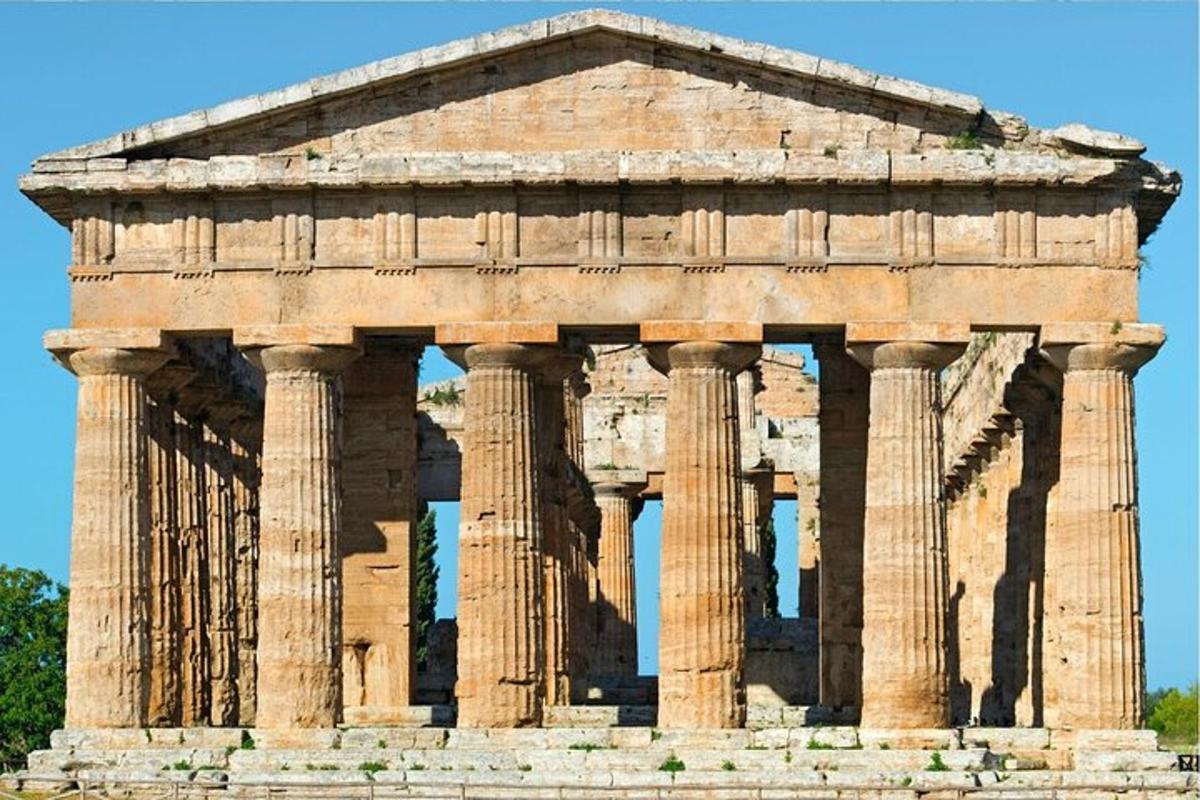 an ancient building with columns in front