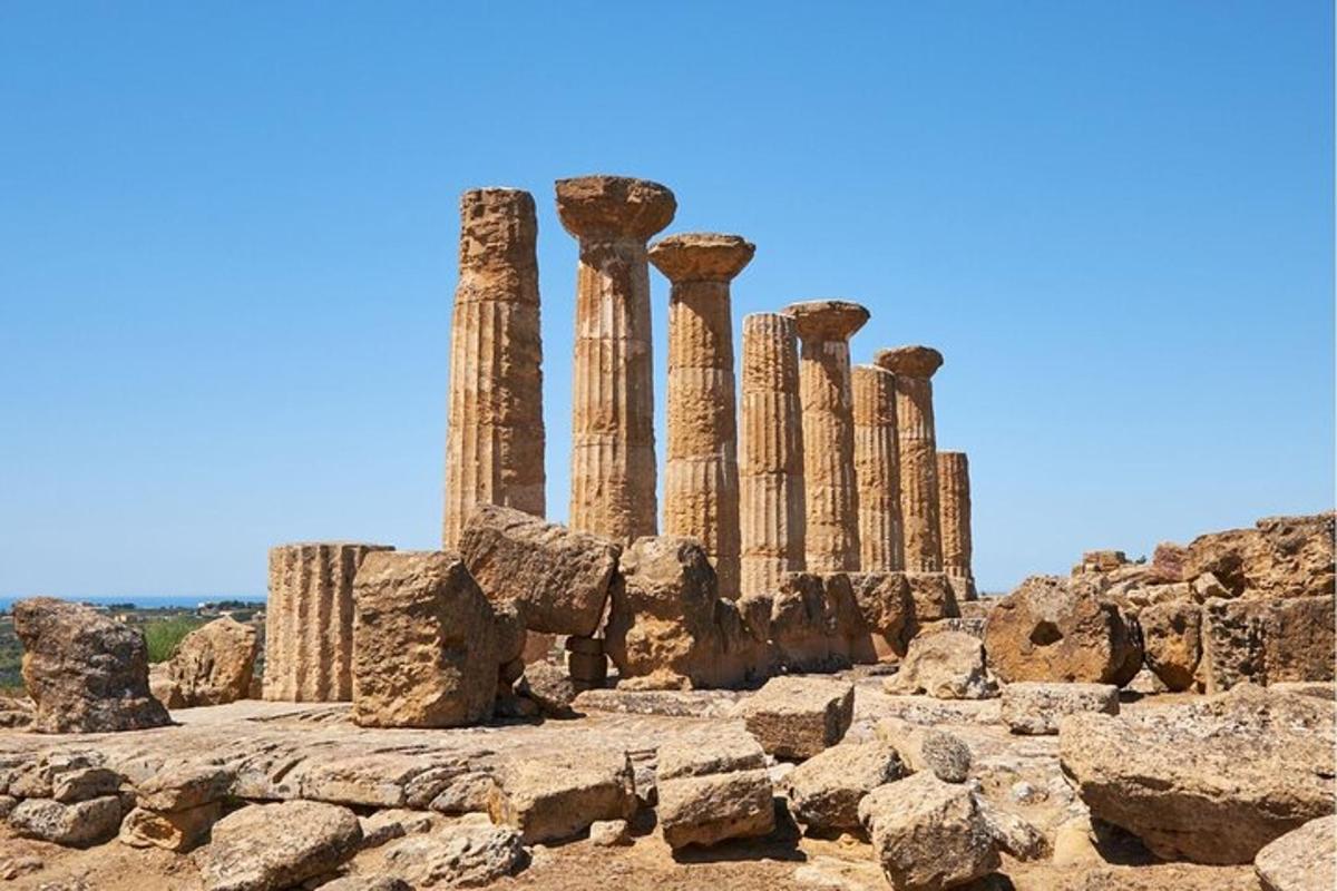 a group of columns on top of a hill