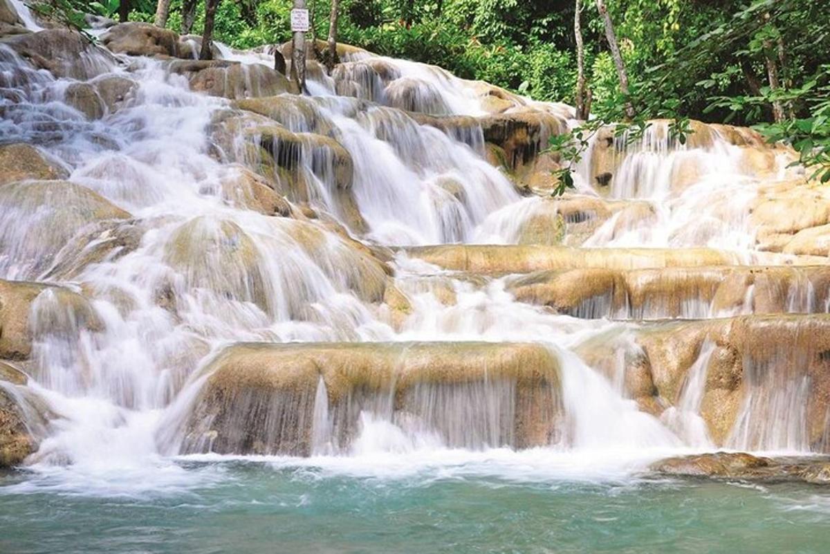 a series of waterfalls in a river with rocks