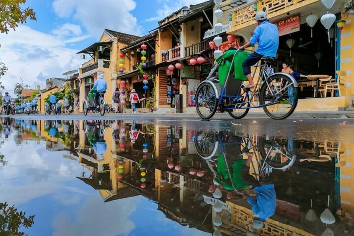 a group of people riding bikes down a street