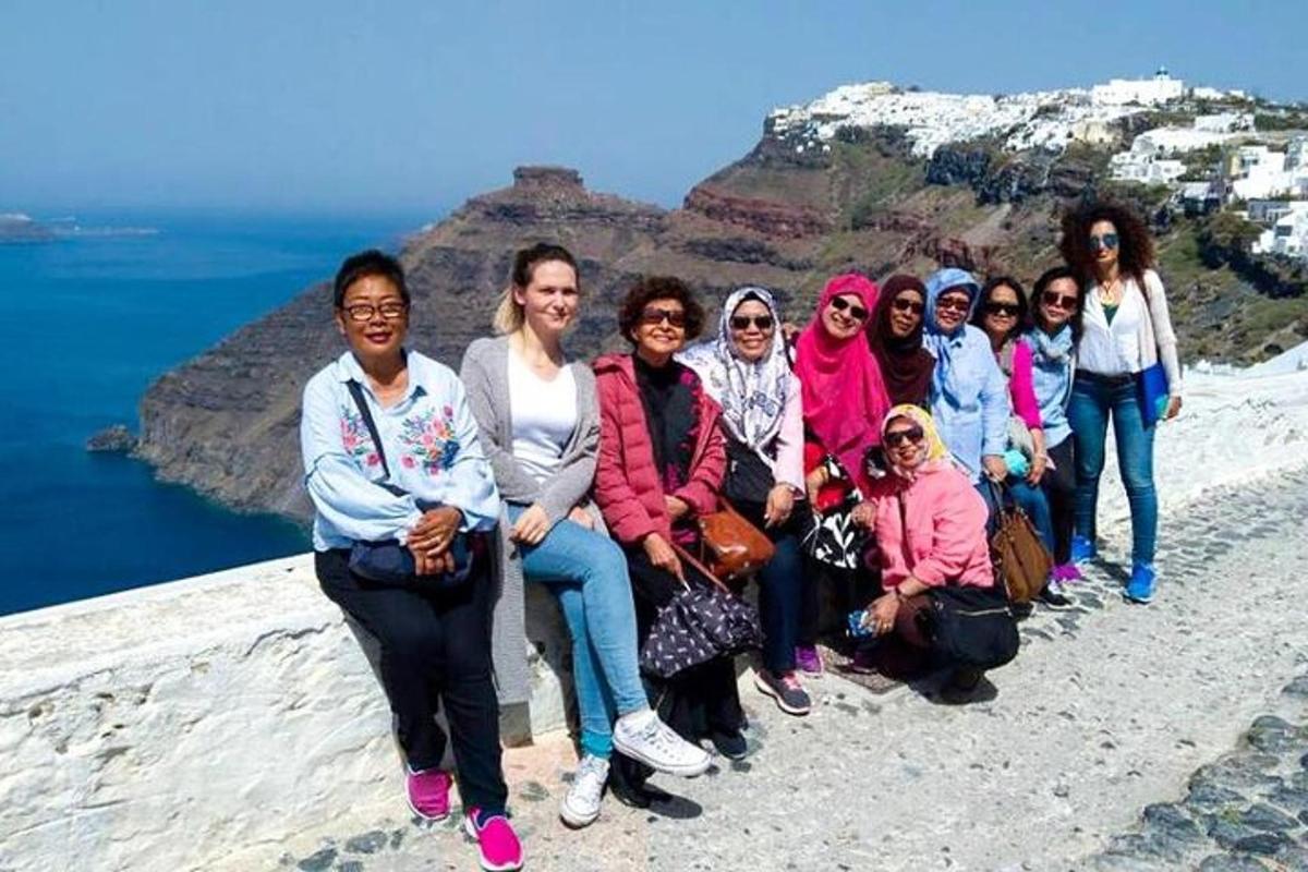 a group of people sitting on top of a mountain