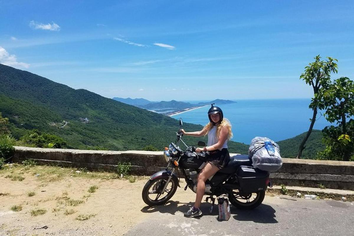 a man is sitting on a motorcycle on the road