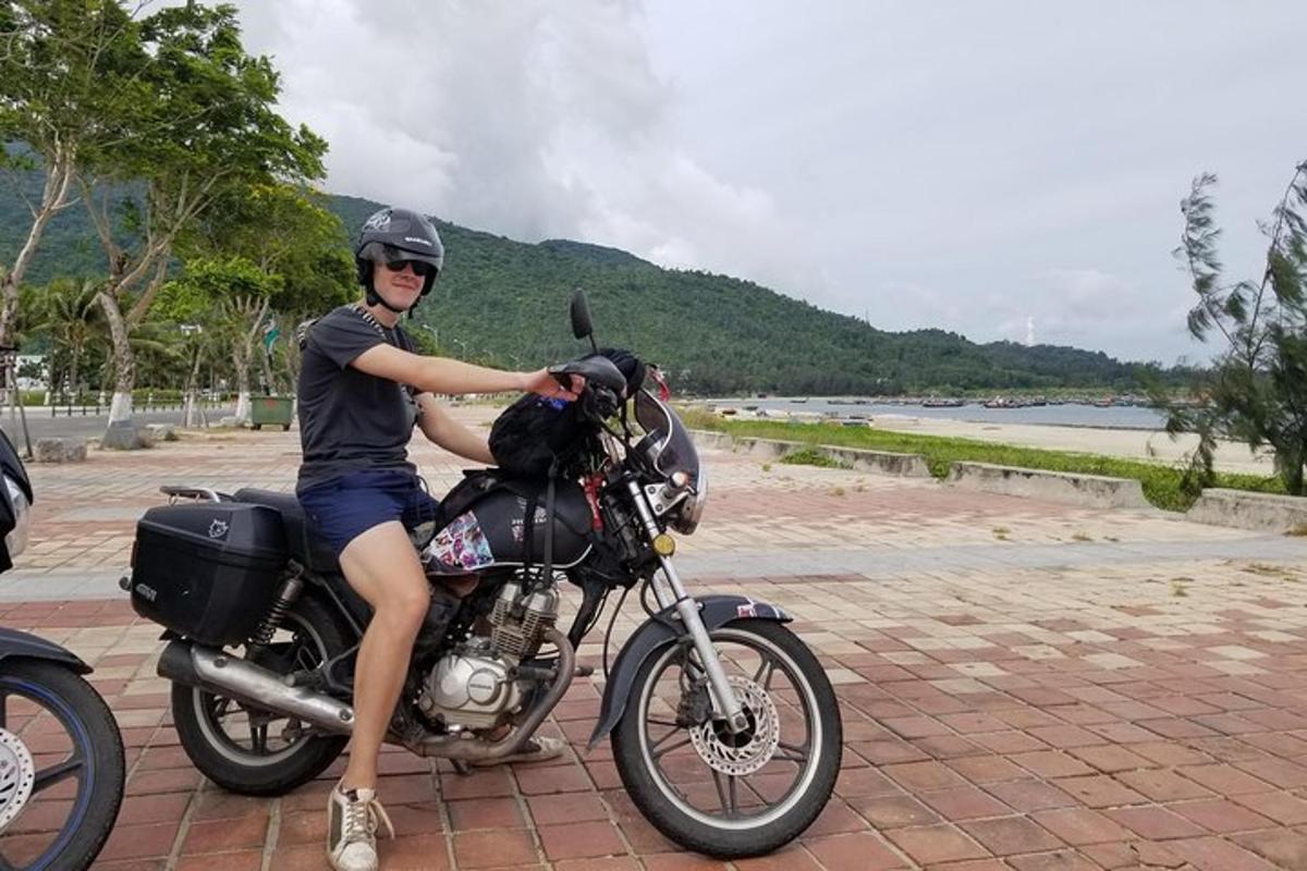 a person is sitting on a motorcycle