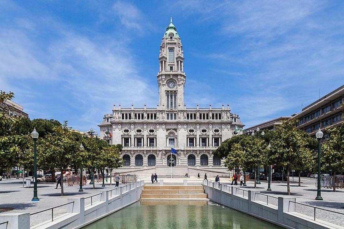 a large building with a clock tower and a fountain