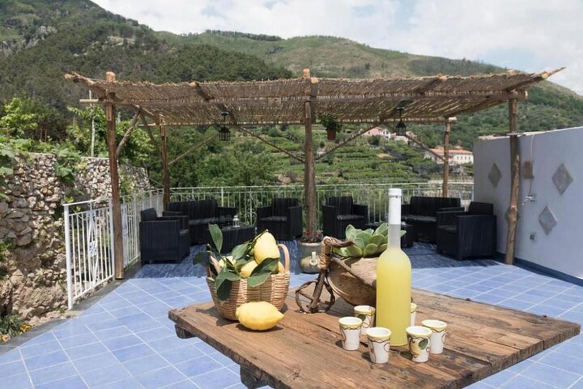 isang mesa na may bote ng alak sa patio