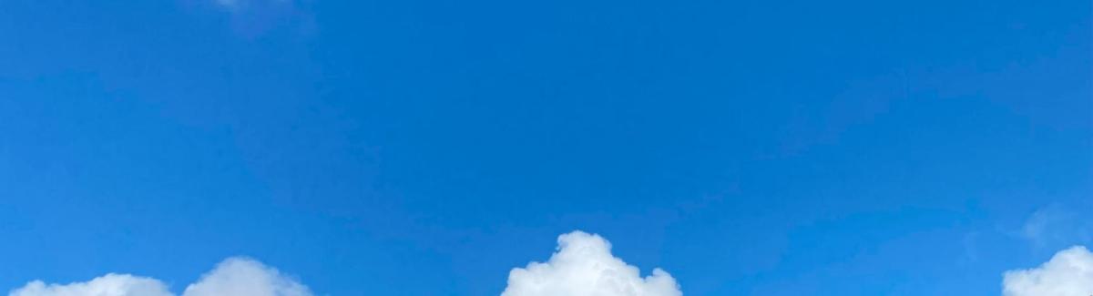 a blue sky with some white clouds in it