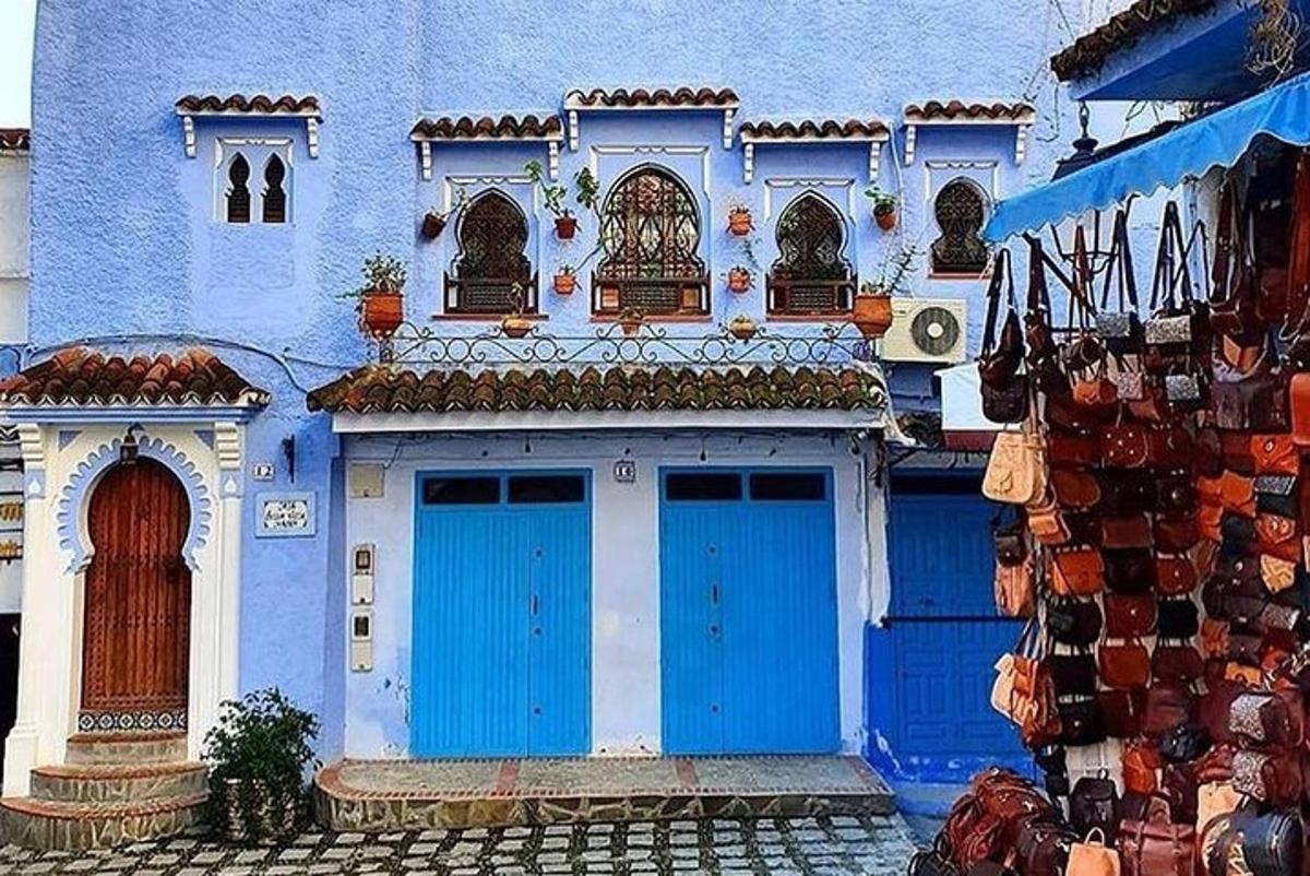 a blue and white building with blue doors