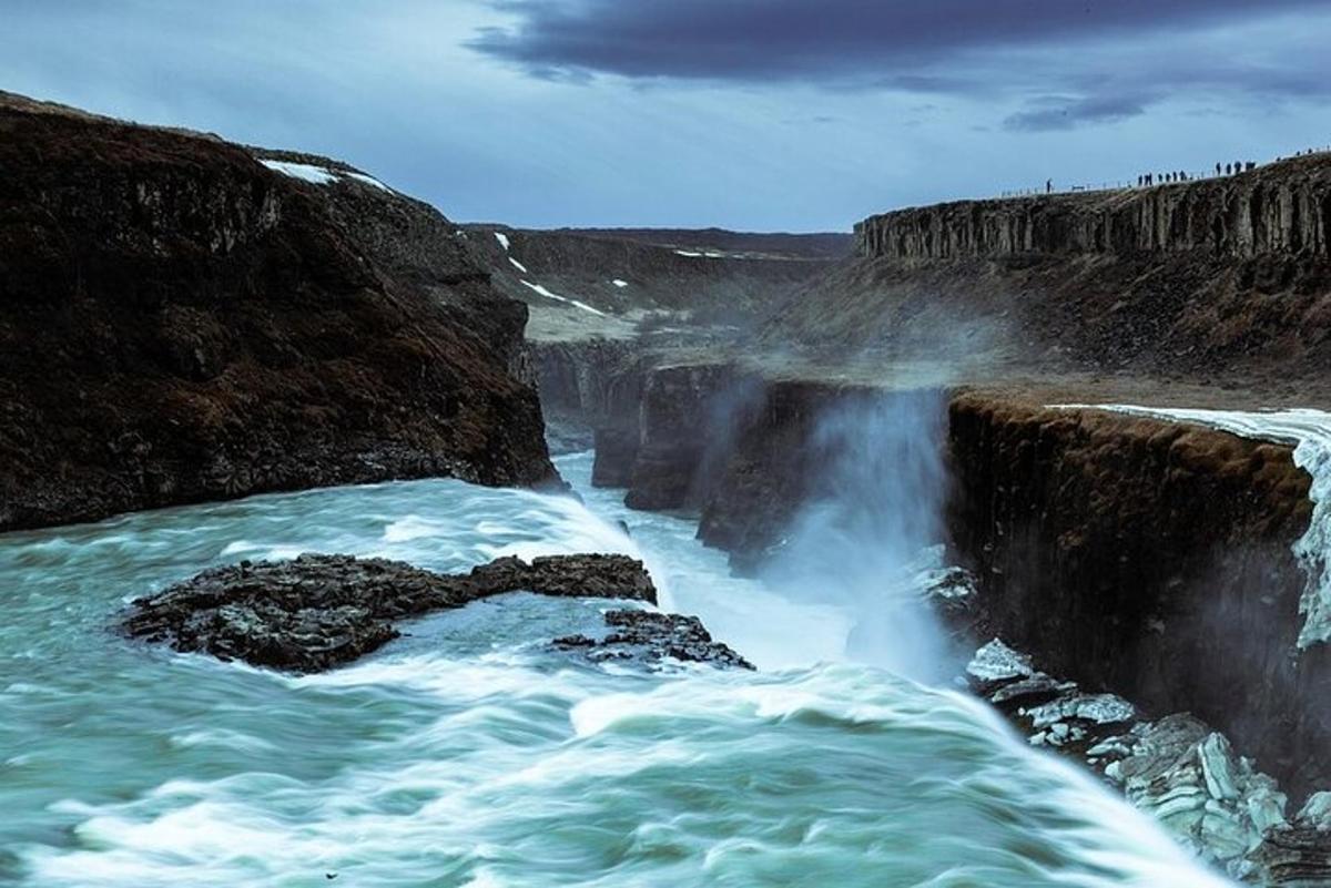 a view of a waterfall with water pouring into a river