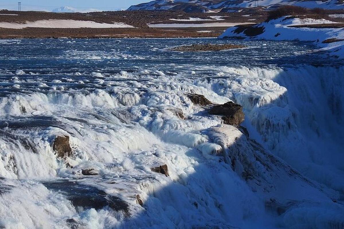 a bunch of snow covered rocks and a river