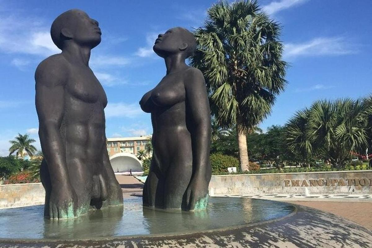 a statue of three children standing in a fountain