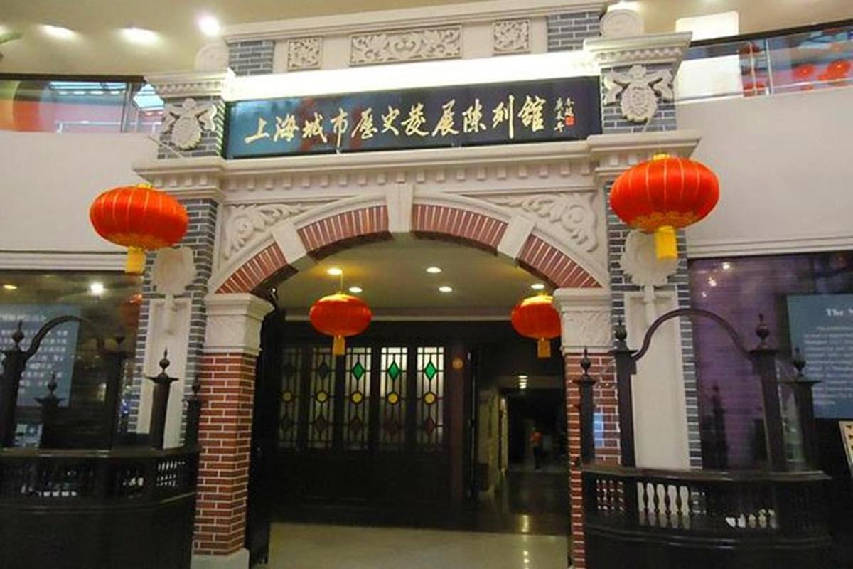 an entrance to a building with orange lanterns on it