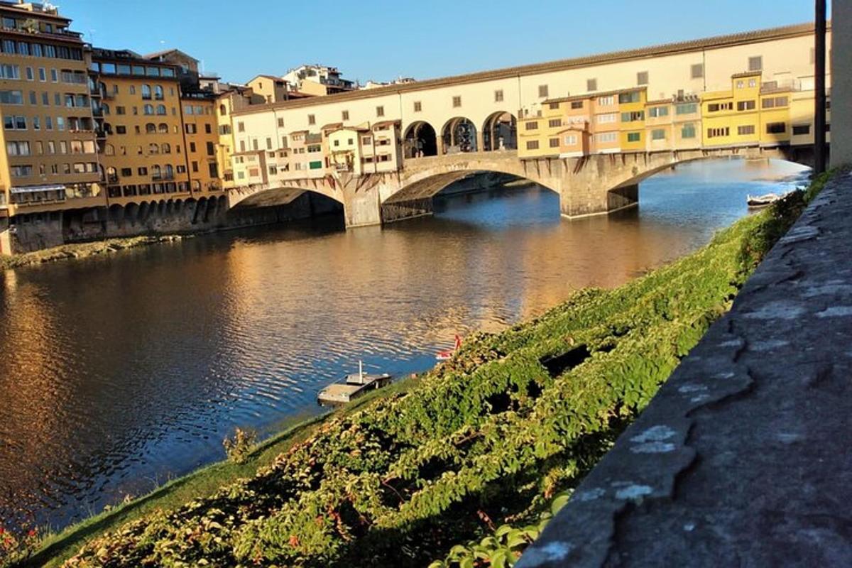a bridge over a river in a city with buildings