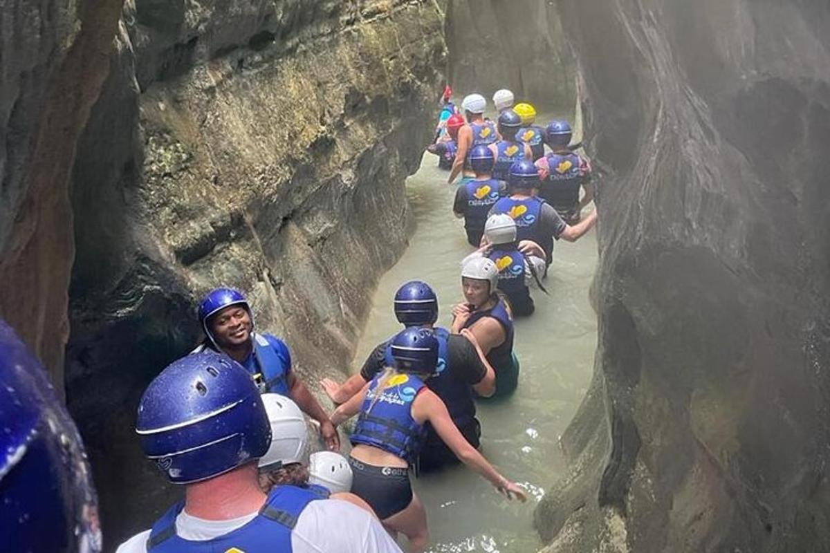 a group of people on a raft in a river