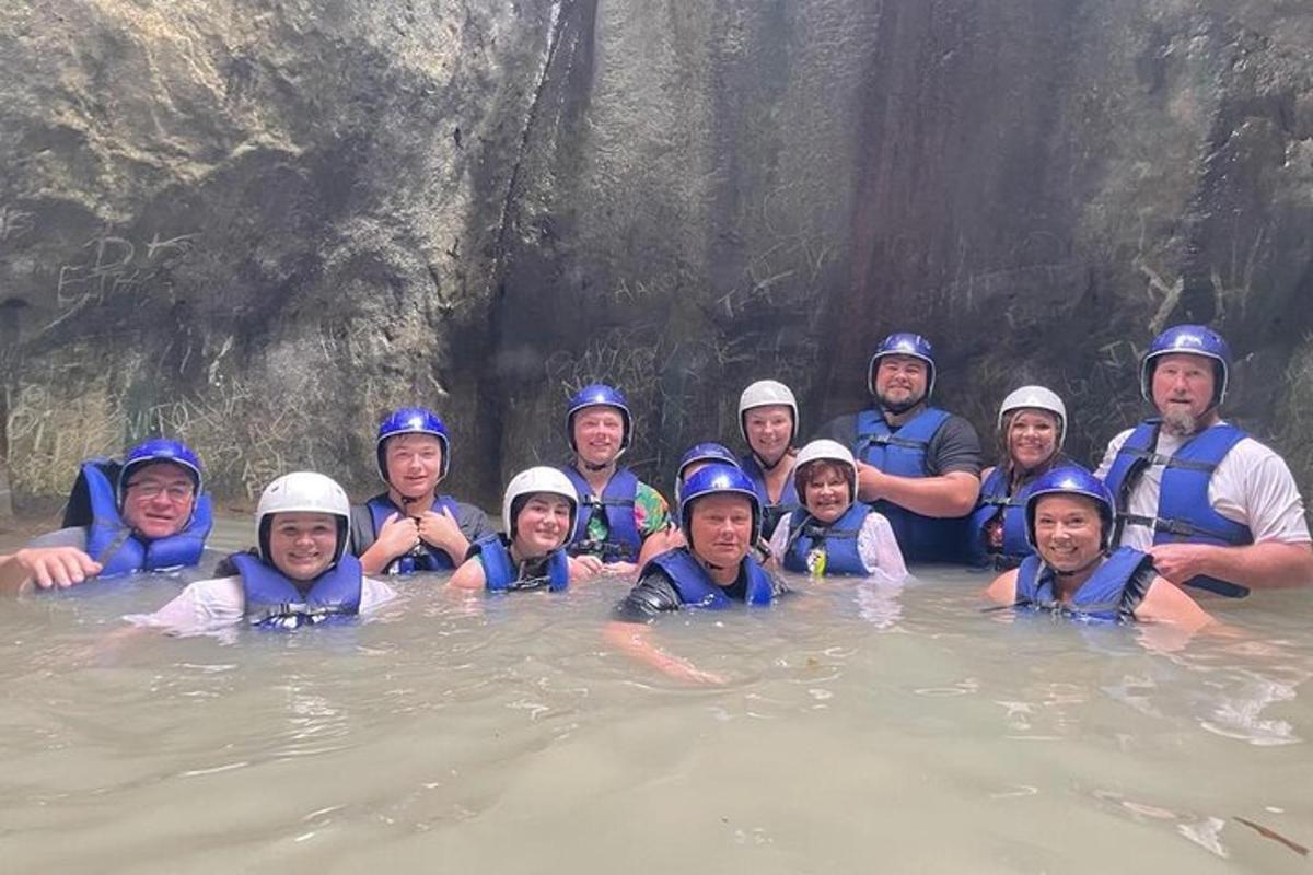 a group of people in the water on a raft