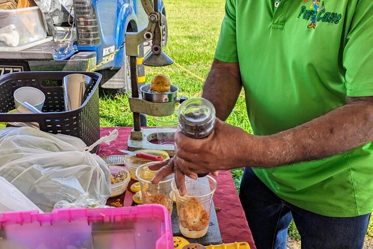 a man standing next to a table with food