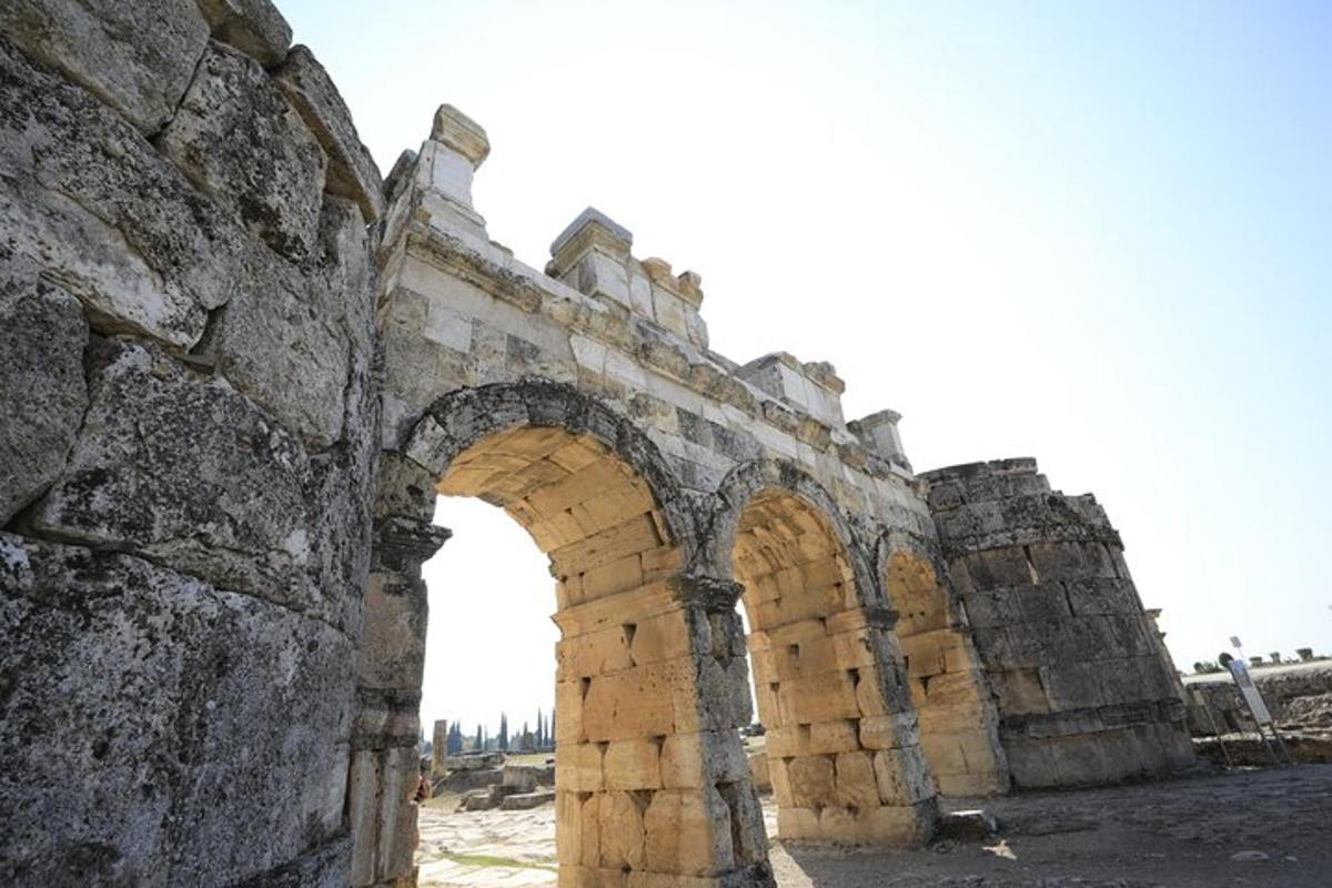 an old stone building with an arch way