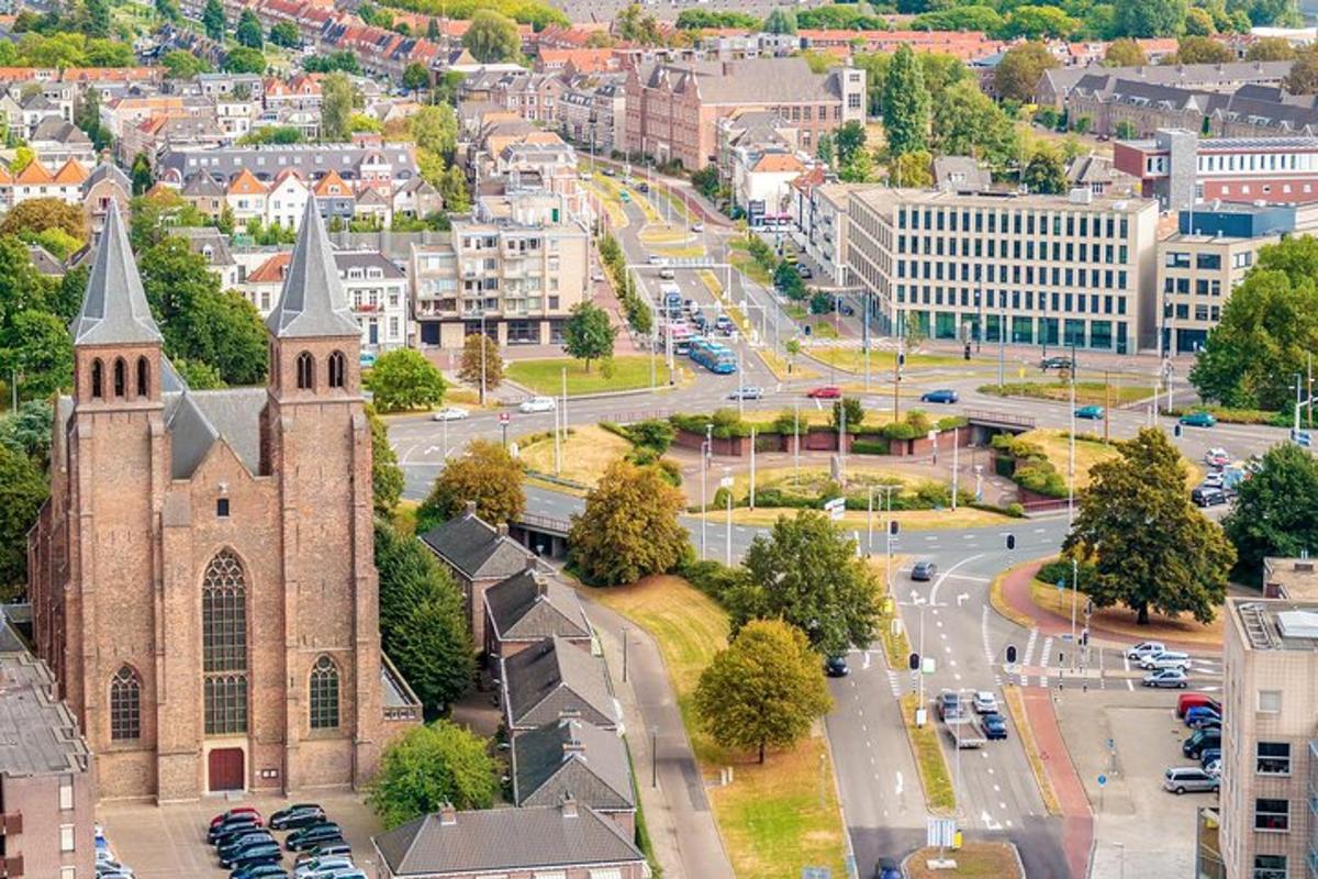 an aerial view of a city with a church