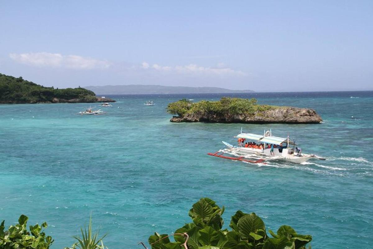 a boat in the water near a small island