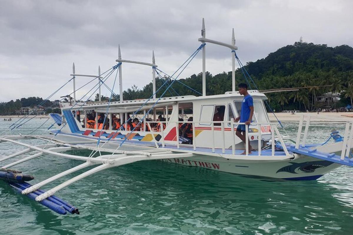 a boat with people on it in the water