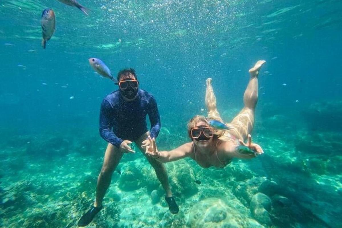 a man and a woman swimming in the water